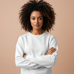 Young Woman in White Sweater with Arms Crossed on Neutral Background