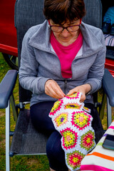 middle-aged woman knitting crochet