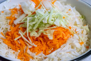 Freshly grated vegetables in a bowl with vibrant colors