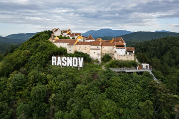Fototapeta premium RASNOV, ROMANIA - JUNE 27, 2024: Drone view of peasant castle in Rasnov.