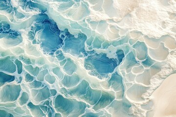 Obraz premium Abstract aerial view of ocean waves, showcasing swirling patterns and textures of turquoise and white foam.