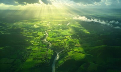 Fototapeta premium Scenic aerial view of lush green valleys and rivers under a bright blue sky, illuminated by natural sunlight, creating a serene and expansive landscape