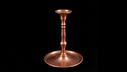 Elegant copper candlestick on black background, minimalist decor
