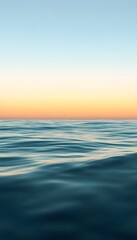 Calm ocean water reflecting the beautiful colors of the sky