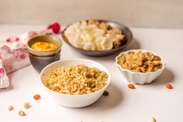 Sabudana khichdi and mango lassi served with fasting snacks.