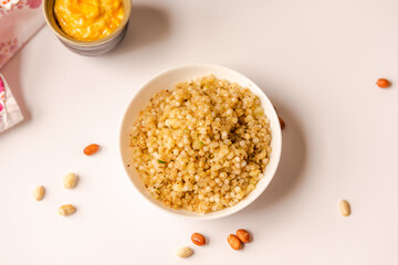 Sabudana khichdi and mango lassi served with fasting snacks.