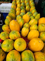 Fresh papaya fruit on display, tropical