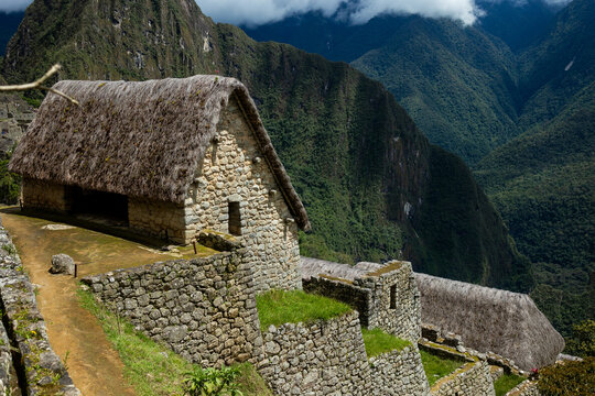 Scenic view of Machu Picchu with traditional Inca hut