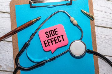 On the tablet for writing the text Side Effects, next to the stethoscope.