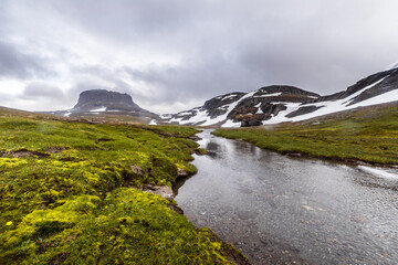 Breathtaking Scenic View of Majestic Mountains and Serene River Flowing Through Lush Greenery Under...