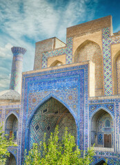 Stunning blue mosaic tiles and intricate patterns adorn the historic ulug beg madrasah in...