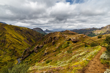 Captivating Landscape of Vibrant Rolling Hills Under a Dramatic Sky Showcasing the Beauty of Nature and Serenity in Untouched Wilderness with Gentle Slopes and Lush Greenery
