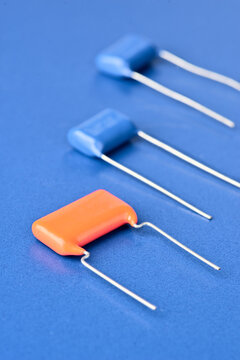 Colorful capacitors on a blue background