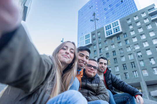 Caregiver Taking a Selfie with Young Adults with Disabilities