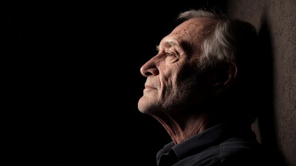 Obraz premium Elderly Man Profile Thoughtful Expression Dark Background Portrait Photography
