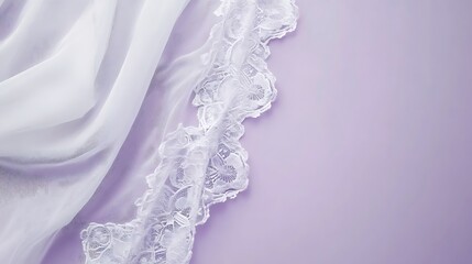 Obraz premium Soft white lace and fabric on a pale purple background