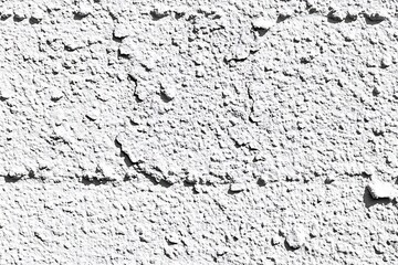 Fototapeta premium Monochrome abstract wall paint texture exhibiting a rough, cracked effect