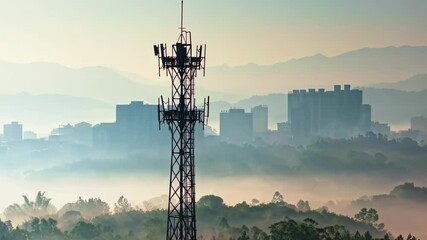 Striking morning fog envelops skyline with communication tower rising above