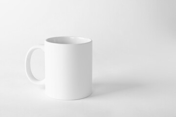 One blank mug on white background. Mockup for design
