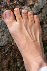 Photos of feet on stone