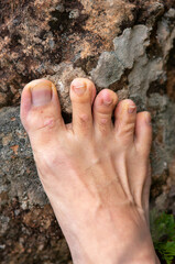 Photos of feet on stone