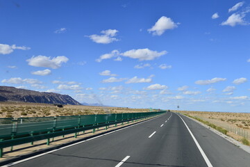 Desert road sand dunes in Xinjiang, China