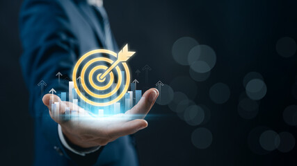 Business goal setting and success strategy. businessman with glowing target with with financial...