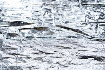 fondo con textura de dobleces de manta de mylar plateada