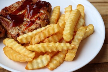 Pork steak grilled barbecue and french fries