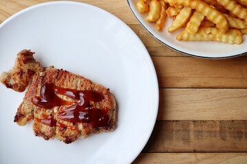 Pork steak grilled barbecue and french fries
