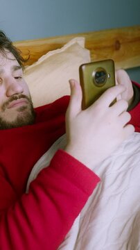 Waking up and immediately reaching for the phone, scrolling endlessly through short videos, and losing track of time ,vertical video