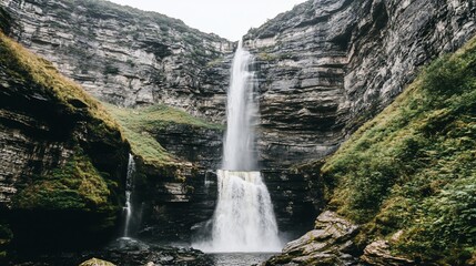 Majestic waterfall cascading down cliffs, lush greenery background, nature travel