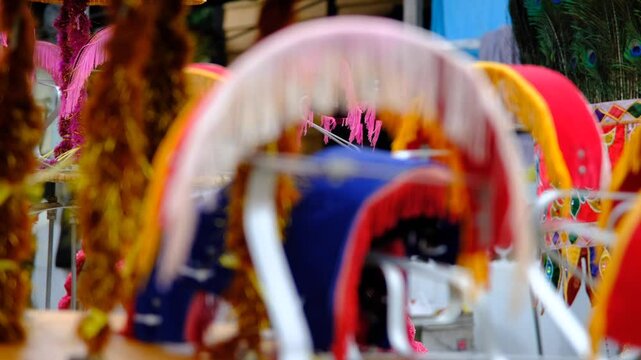A vibrant and colorful background with blurred festive decorations, intricate details, and cultural elements, evoking a lively and celebratory atmosphere with traditional influences.