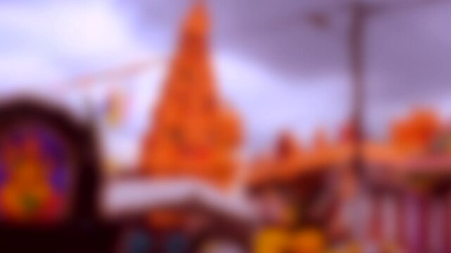 a blurred background of an orange-hued temple or pagoda structure, set against a cloudy sky, evoking a spiritual, cultural, and historical ambiance
