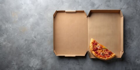 A partially eaten pizza slice rests inside a cardboard pizza box on a textured surface