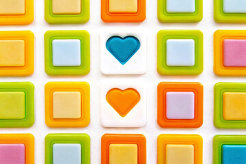 Colorful square pattern with two hearts.