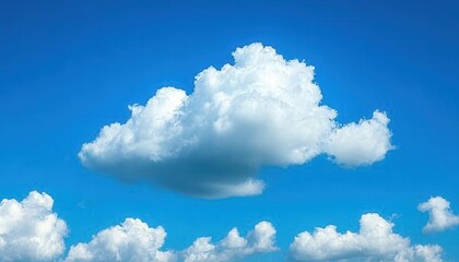Obraz premium Single fluffy white cumulus cloud in a vibrant blue sky