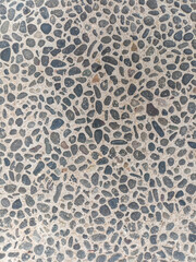 gravel surface with various colors and sizes neatly arranged.