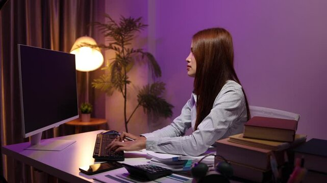 a businesswoman works late into the night because she has to deal with important contract documents that ned to be presented tomorrow, one of the employees worked overtime