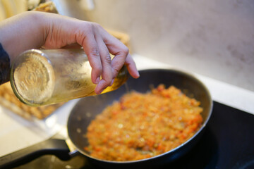 Cooking vegetables in a skillet for healthy meal preparation