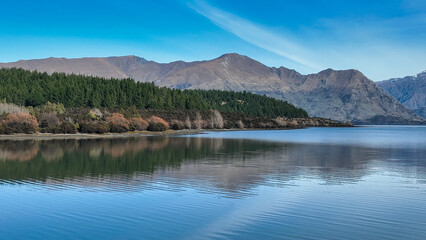 Aerial views of Glendhu Bay coastline at Lake Wanaka on a beautiful sunny day