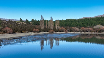 Fototapeta na wymiar Aerial views of Glendhu Bay coastline at Lake Wanaka on a beautiful sunny day