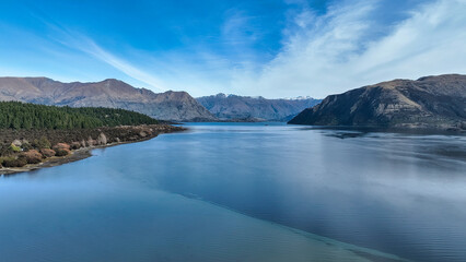 Aerial views of Glendhu Bay coastline at Lake Wanaka on a beautiful sunny day