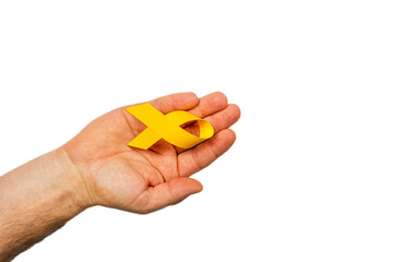 Holding yellow ribbon symbolizing cancer awareness and support for patients