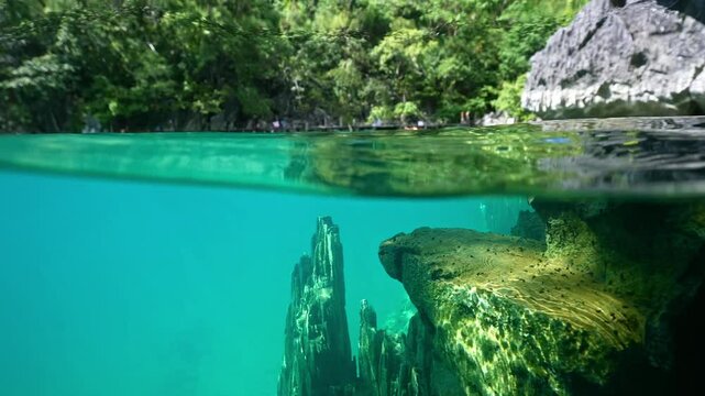 snorkeling Kayangan Lake limestone rocks in Philippines. tourism destination for snorkeling and scuba diving in Coron, Palawan. 