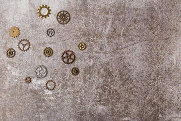 Aged gears on dark background. Flat lay, top view. Copy space