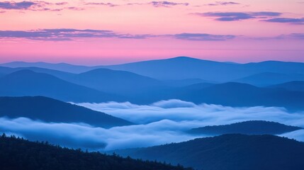 Fototapeta premium Sunrise over misty mountain range