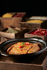 Spicy stewed hairtail with red oil in casserole