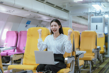Fototapeta premium A cool businesswoman sits by the airplane window. She enjoys a luxurious travel experience that symbolizes success, adventure, and the excitement of traveling to new destinations.