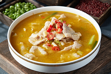 Boiled pork slices in sour soup with pepper and sesame